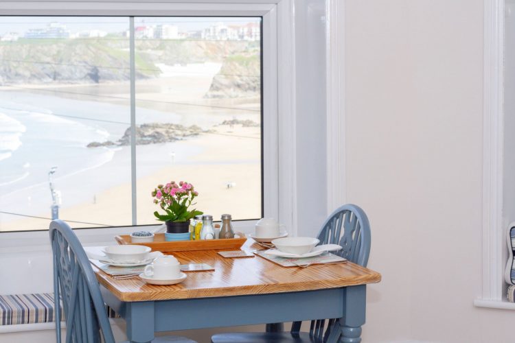 Breakfast room table with Towan Beach in the background
