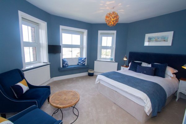 Fistral Suite, blue room with two blue chairs and coffee table